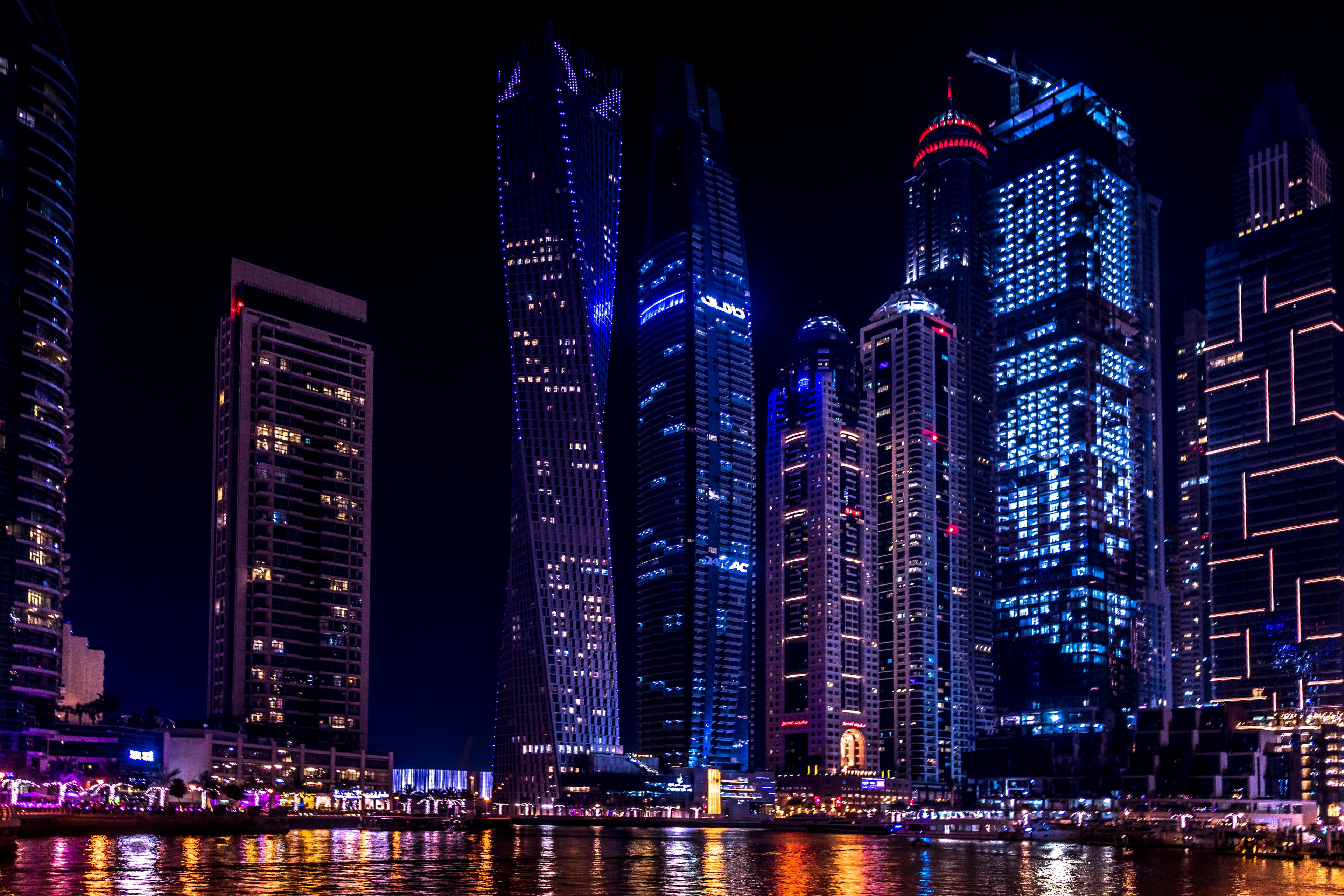Luxury chauffeur service fleet of black Mercedes-Benz vehicles with Dubai skyline